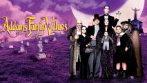 A portrait of a family with pale faces, dressed in black, standing in front of a purple background.