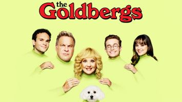 a family of 5 plus a white dog on a yellow background with the Goldbergs words