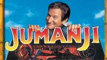 A middle-aged man behind a board game and logo that reads, Jumanji.